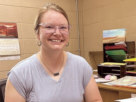 A mom Behind the desk at SMS